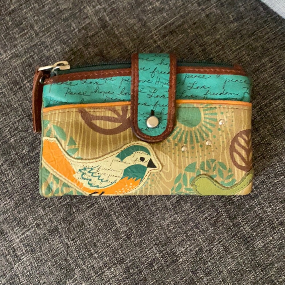 Fossil Wallet with bird detail and design.